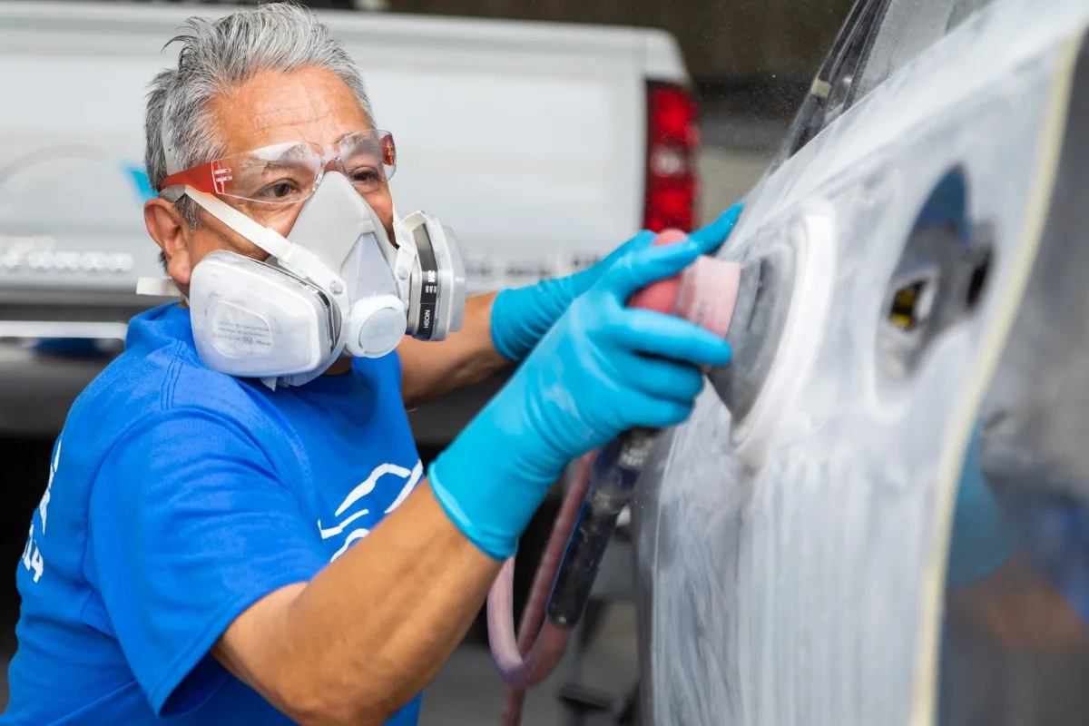 Santa Ana technician preparing a vehicle for precision refinishing